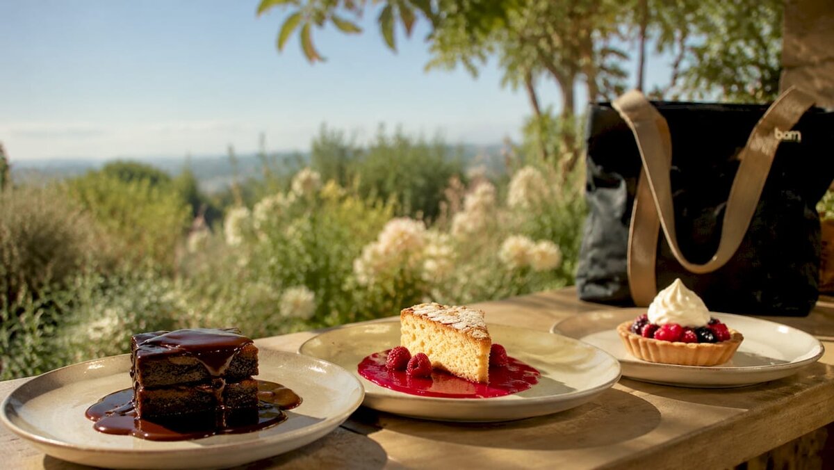 Varied dessert dressings on plated cakes close-up